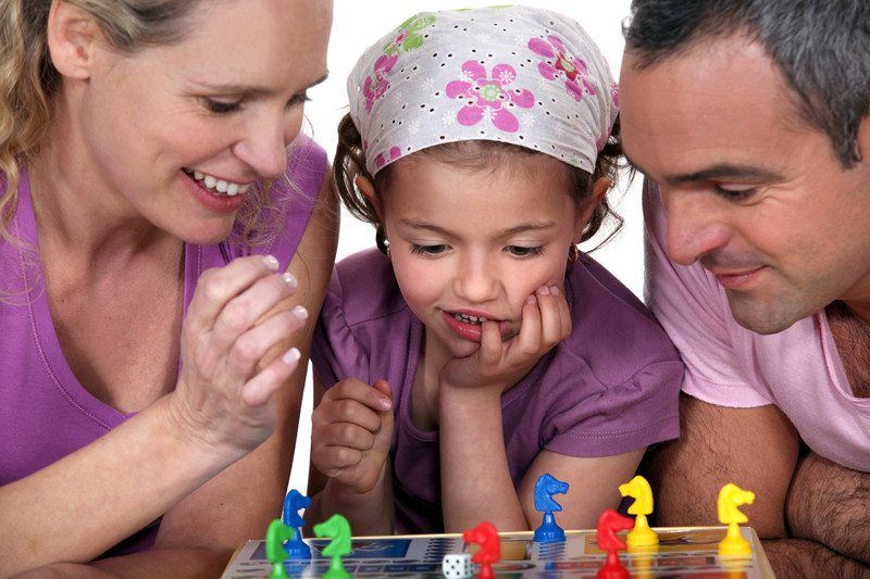 Family playing a board game