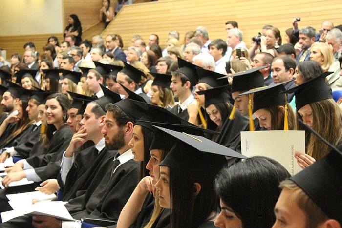 Large auditorium where a ceremony is taking place for college graduates as an example of jobs for graduates in 2017