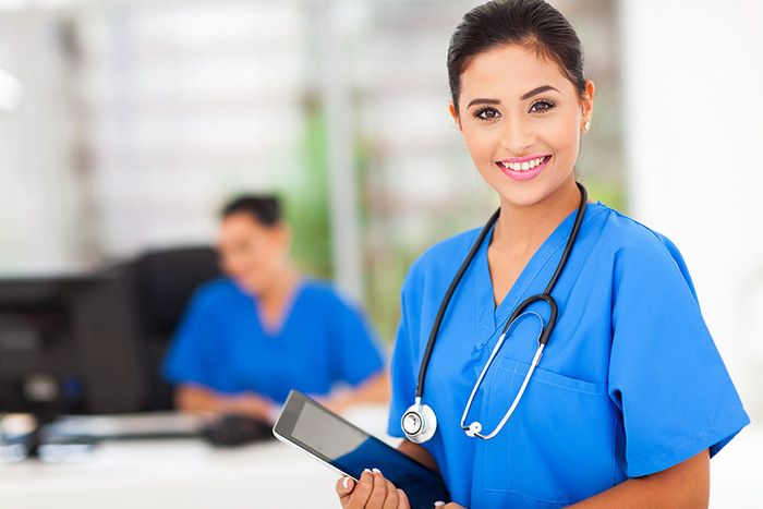 Woman wearing a nursing uniform working as a nurse in a clinical setting representing nurses who want to make a difference