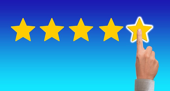 Graphic of a person giving 5-star feedback review as an example of book reviews