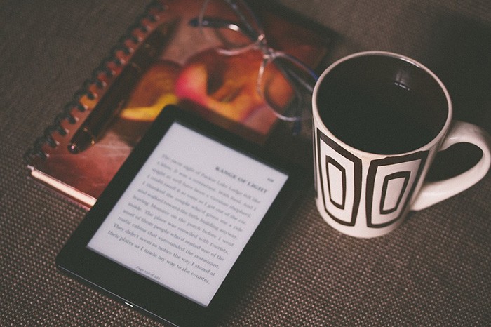 Photo of an e-reader sitting on a table as an example of jobs writing eBooks