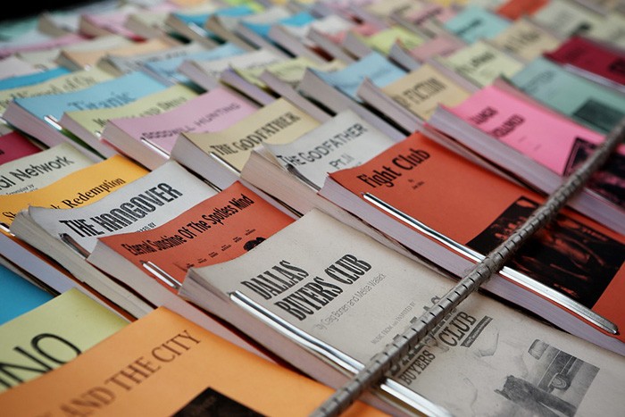 Photo of a stack of books as an example of jobs writing subtitles