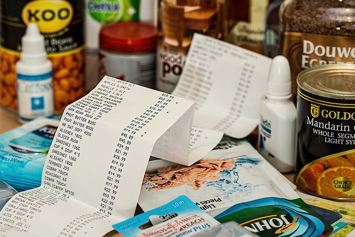 Photo of a table full of products with a receipt sitting on top as an example of getting paid to be a secret shopper