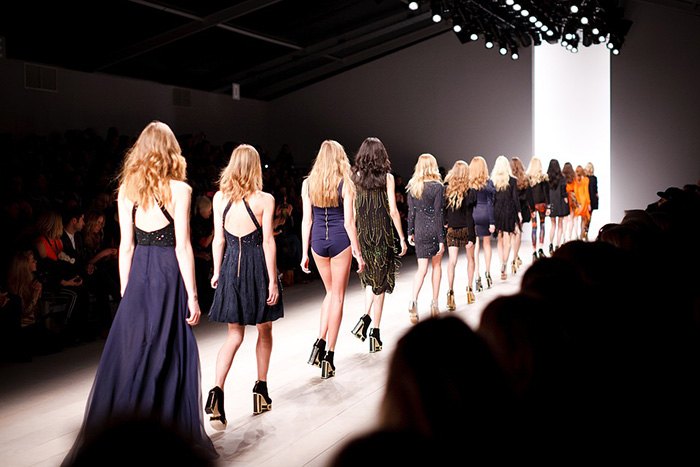 Photo of a fashion show runway as an example of getting paid to write about fashion