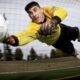 Photo of a soccer goalie diving for a ball as an example of writing about sports