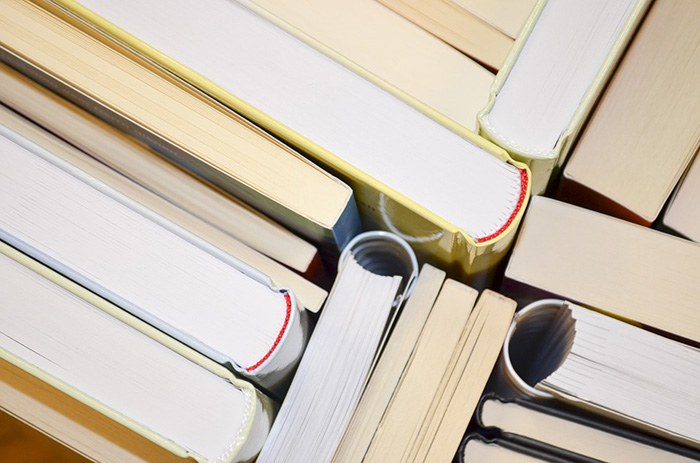 Photo of a stack of books as an example of getting paid to write fiction