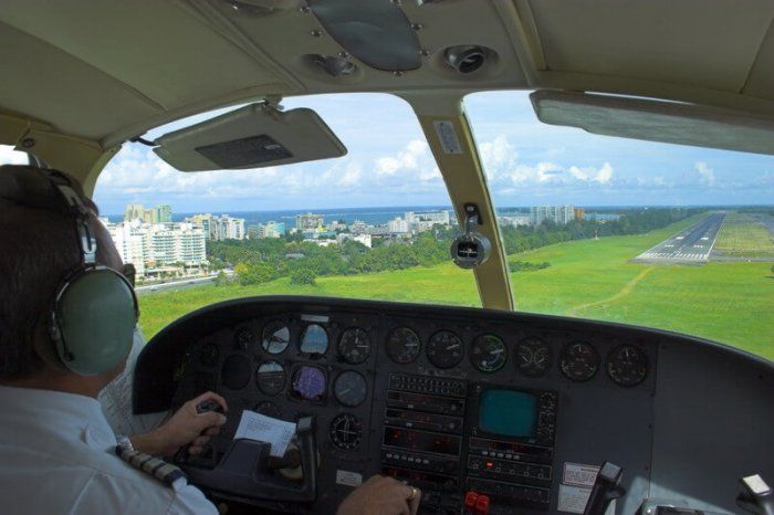 commercial pilot getting ready to land the plan in a field