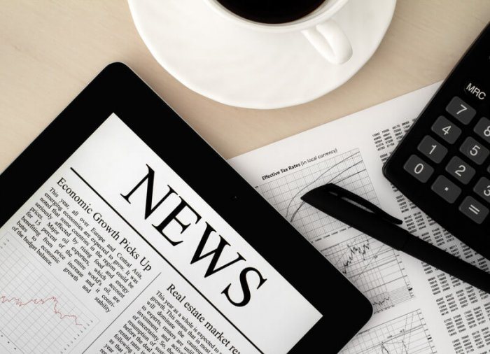 best news plugins WordPress | One More Cup of Coffee digital newspaper with the word "News" at the top of the page displaying on an iPad