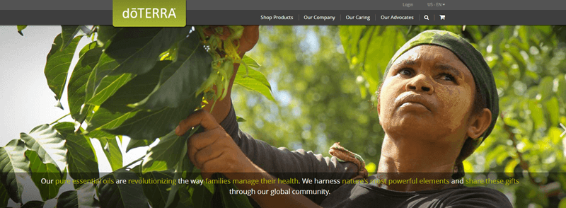 doTERRA website screenshot showing a young woman outside surrounded by leaves. 