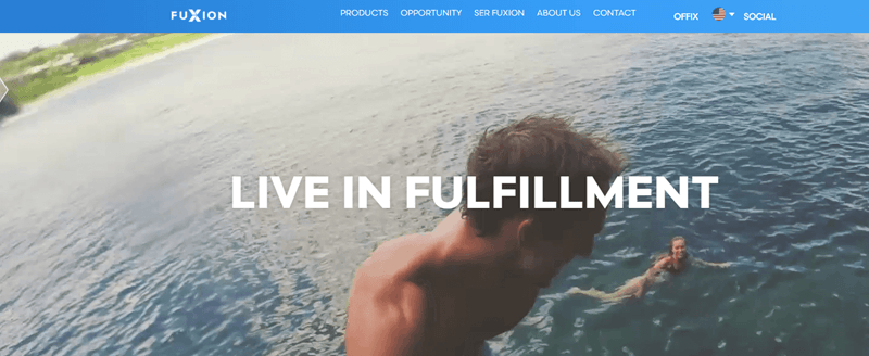 FuXion website screenshot showing a young woman swimming in the sea and a young man by the camera looking back at her. 