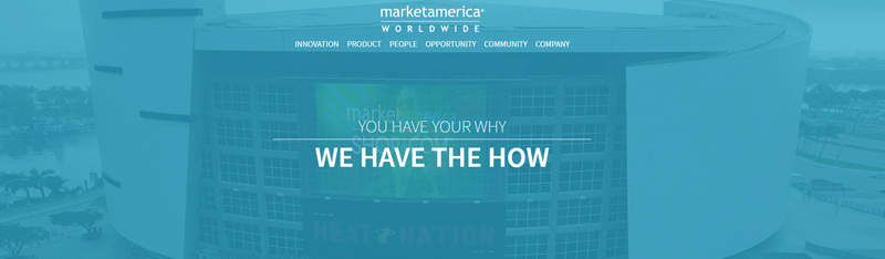 Market America website screenshot showing a background image of a large arena. 