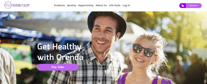 Orenda International website screenshot showing a young couple outside at a market. 