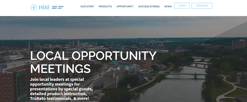 Visi website screenshot showing a high view of a city. This is overlaid with white text that talks about Local Opportunity Meetings. 