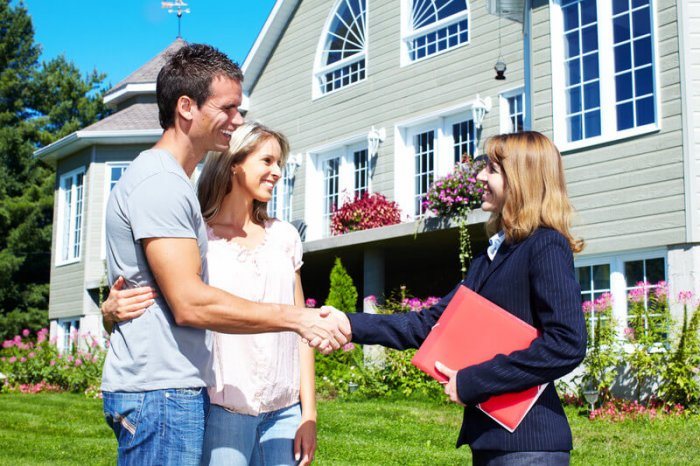 best real estate agent plugins wordpress | One More Cup of Coffee real estate agent showing a house to a young couple that discovered the property using her WordPress plugin
