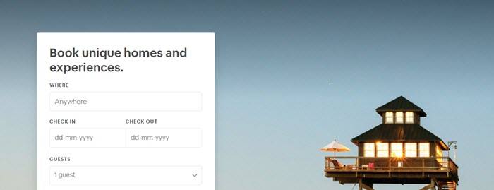 Airbnb website screenshot showing a freestanding loft-style house contrasted against the open sky. 