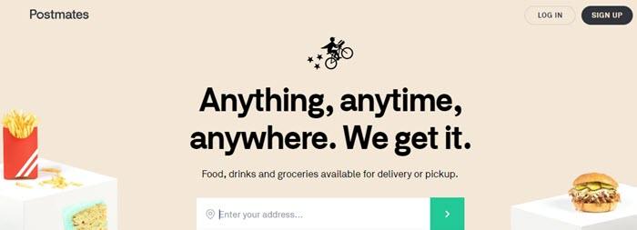 Postmates website screenshot showing white cubes with food on them (fries, cake and a burger) against a beige background. 