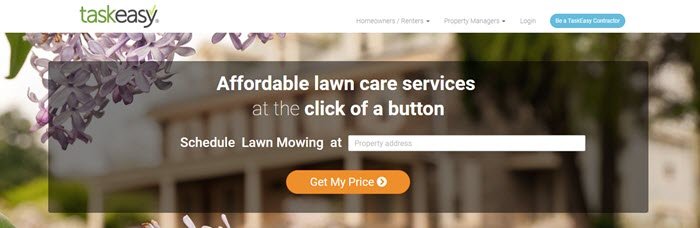 TaskEasy website screenshot showing an out of focus image of apartments with purple flowers, along with details about affordable lawn care services. 