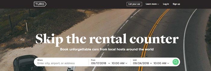 Turo website screenshot showing an overhead image of an open road with a man and a car.