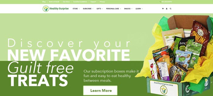 Healthy Surprise website screenshot showing one of their boxes and the various products, against a two-tone green background.