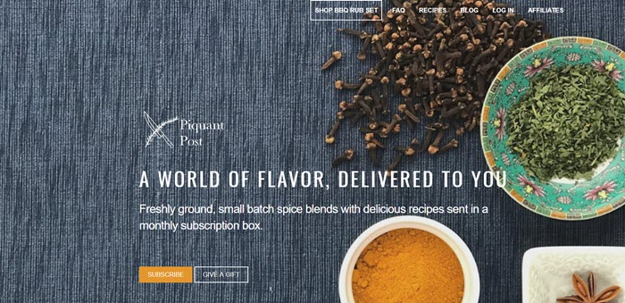 Piquant Post website screenshot showing an overhead view of some spices against a blue fabric background. 