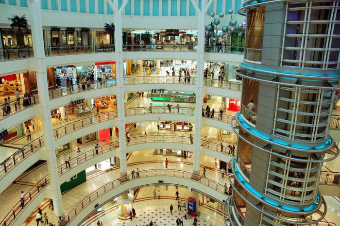 multi-story shopping mall with products being sold