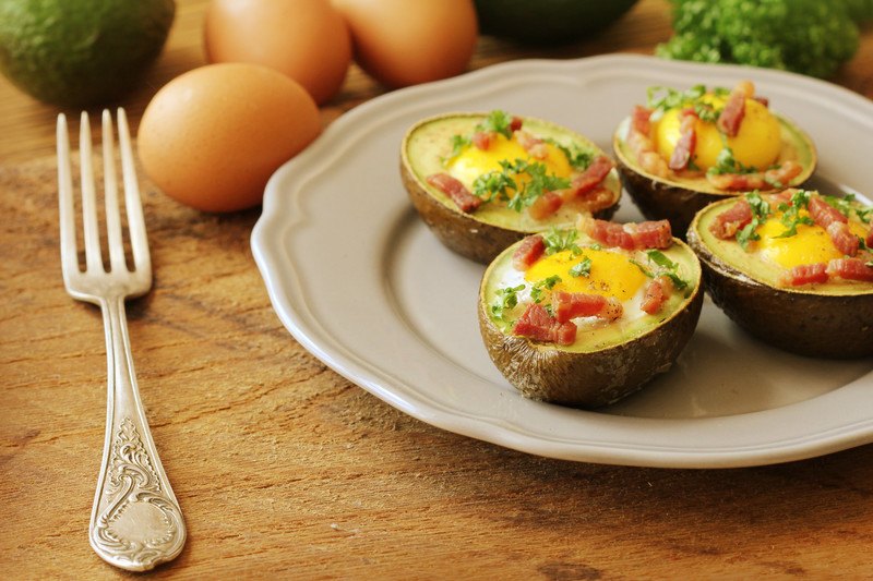 best keto affiliate programs | One More Cup of Coffee baked avocado with egg, cheese, and bacon in the middle