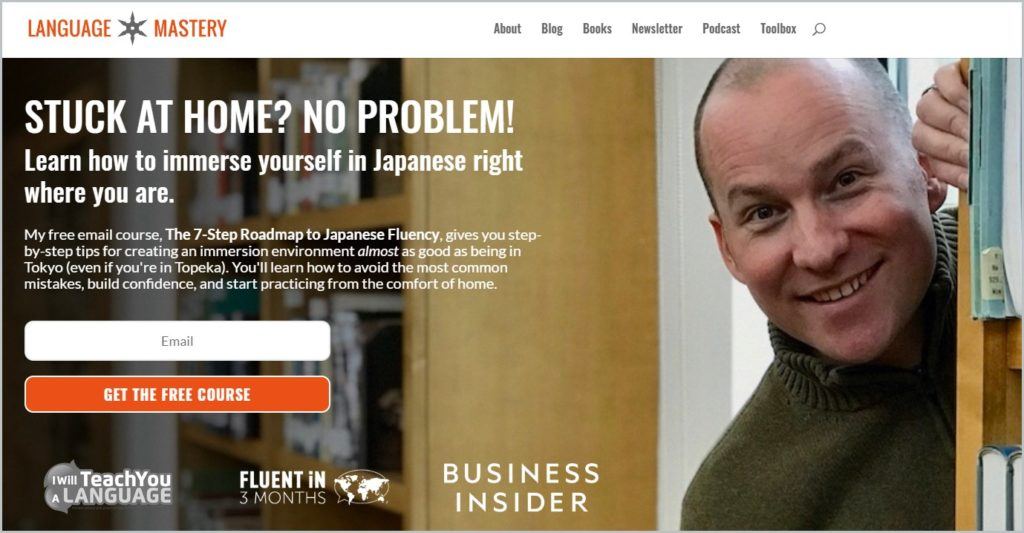 Screenshot of Language Mastery homepage with white header with the website name and main navigation menu