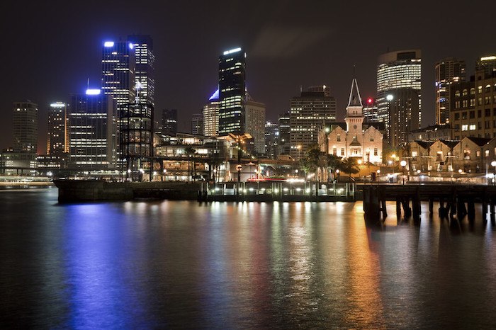 view of the sydney skyline at night showing the best australia affiliate programs