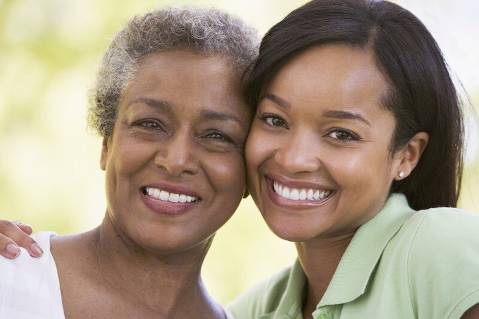 african american young lady and her mother smiling representing the best mothers day affiliate programs