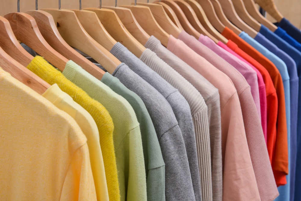 colorful t shirts on a rack representing t shirt affiliate programs