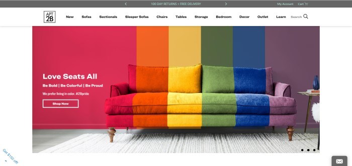 This screenshot for the home page of Apt2B shows a sofa and wall with matching stripes of red, orange, yellow, and blue, from left to right.