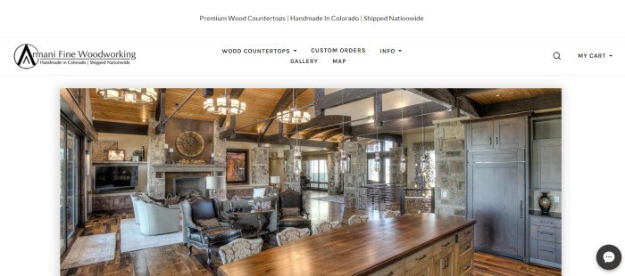  This screenshot of the home page of the Armani Fine Woodworking website includes a large photo of a beautiful kitchen area with stone walls, hardwood floors, and fine wooden countertops by Armani fine Woodworking.