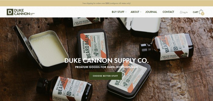 This screenshot from the home page for Duke Cannon shows an assortment of beard balms and oils in rectangular tins or dark glass bottles. 