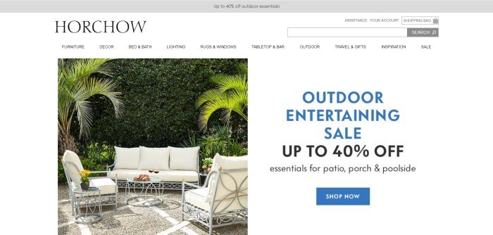 In this screenshot of the home page for Horchow, a photo of white patio furniture on a patio near some trees sits to the left of an advertisement for a summer sale, in blue and black text on a white background.