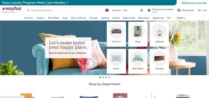 This screenshot of the home page for Wayfair shows a light blue couch with orange and pink throw pillows in front of a matching blue wall, along with six images of products to look at. 