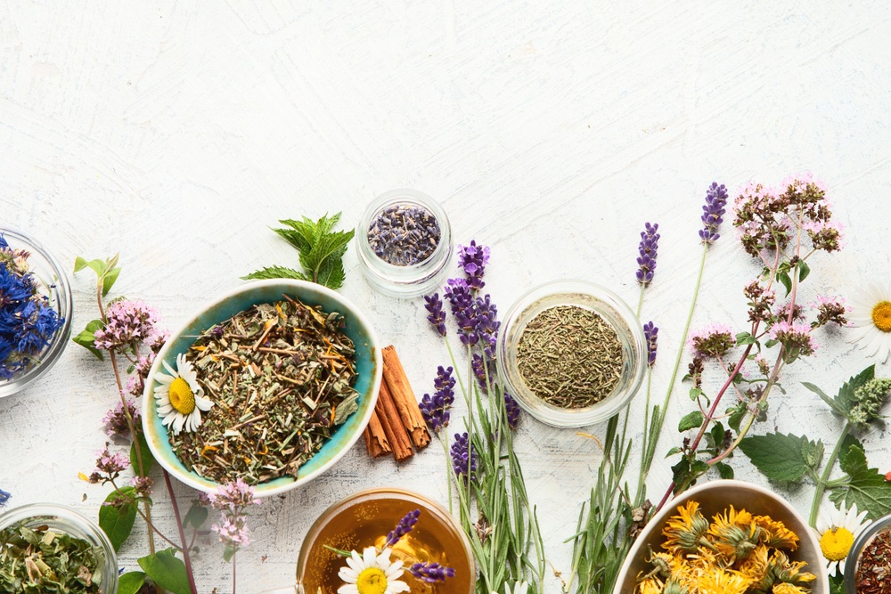 dried herbs of various kinds in variated bowls to represent herbal affiliate programs