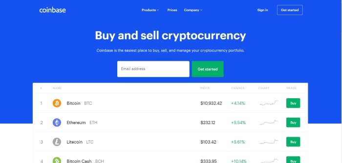 This screenshot of the home page for Coinbase shows a white background with a large blue section announcing the ability to buy and sell cryptocurrency and a large white window showing exchange rates for various cryptocurrencies. 