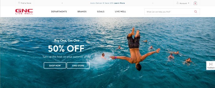 This screenshot of the home page for GNC shows a man flipping into the ocean while around seven other people who are already in the water watch and smile, along with an advertisement in white text for a 50% off summer sale. 