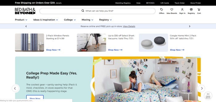 This screenshot of the home page for Bed, Bath, and Beyond has a white background, a black text navigation bar, a row of photos showing featured products like vacuum cleaners and drapery panels, and an aqua text box with black text announcing college prep gear next to a photo of a college-age woman lying on her stomach on a dorm bed, typing on a laptop. 