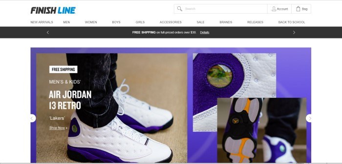 This screenshot of the homepage for Finish Line shows a pair of white sneakers on someone's feet and a few closeup views of some of the details on this particular brand of sneakers. 