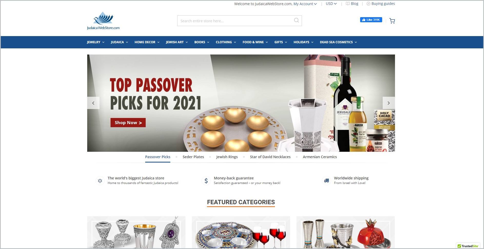 screenshot of Judaica WebStore homepage, with white header bearing the website's name and search bar, under that is a blue bar with the navigation menu, it also showcases images of the website's products