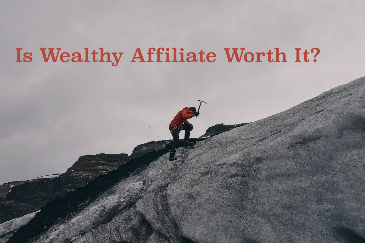 man climbing icy mountain with pickaxe and title text, "is wealthy affiliate worth it?"