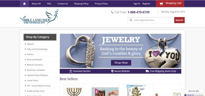 This screenshot of the home page for the Bibleland Shop has a white background with dark blue text and a large photo showing silver jewelry against a blue background. 