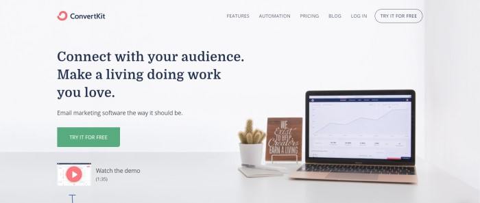 This screenshot of the home page for ConvertKit has a gray background, black text, and a photo of an open laptop on a desk next to a potted cactus. 