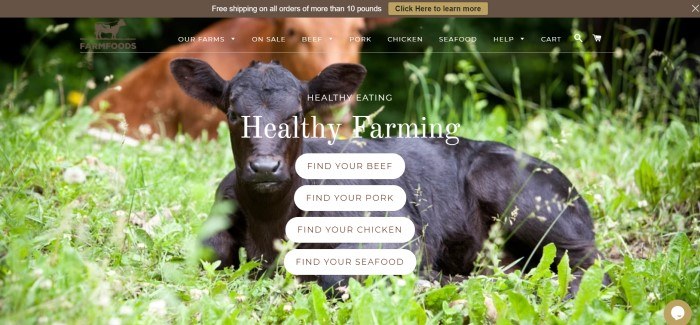 This screenshot of the home page for Farm Foods shows a black cow lying in a green field, behind white bubble invitations for customers to discover farms where beef, pork, chicken, and seafood are sourced.