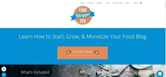  This screenshot of the home page for Food Blogger Pro has a white header with the orange and blue logo centered in the middle, above a blue section with an orange call-to-action button and white text inviting customers to learn how make a business from their food blog.