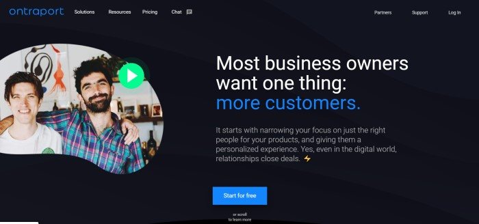 This screenshot of the home page for Ontraport has a black background with white and blue text explaining that most people want more customers, and even in the digital world, relationships close deals, along with a photo of two men standing next to each other and smiling at the camera.