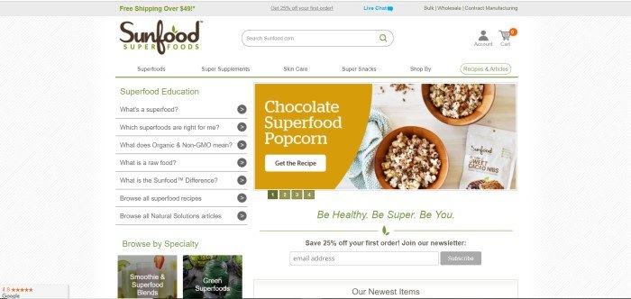 This screenshot of the home page for Sunfood has a white background with gray diagonal stripes, a question and answer section on the left side of the page, and an advertisement for chocolate superfood popcorn on the right side of the page, including an overhead photo of two bowls of chocolate-drizzled popcorn.