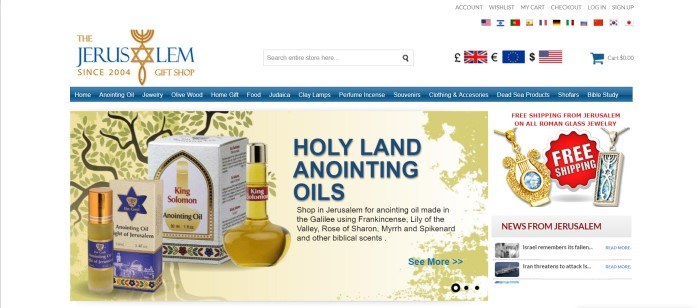 This screenshot of the home page for The Jerusalem Gift Shop has a white background, a blue header, and a golden graphic section with an image of a tree introducing holy anointing oils and including a picture of a few different types of oils, such as King Solomon oil and Light of Jerusalem oil.