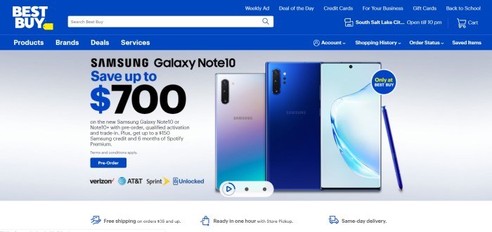 This screenshot of the home page for BestBuy includes a blue navigation bar, a gray background, and a row of Samsung Galaxy Note devices, along with an advertisement in black text for 0 off.